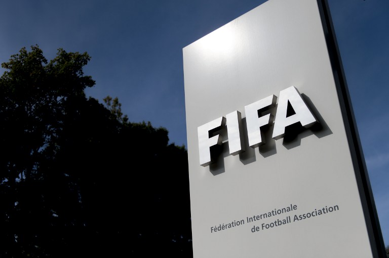 The logo of the global football's governing body FIFA is seen on October 3, 2013 at its headquarters in Zurich. FIFA kicked off a crunch meeting behind closed doors, amid claims of rights abuses by 2022 World Cup Qatar and wrangling over plans to hold the tournament in the winter. AFP PHOTO / FABRICE COFFRINI