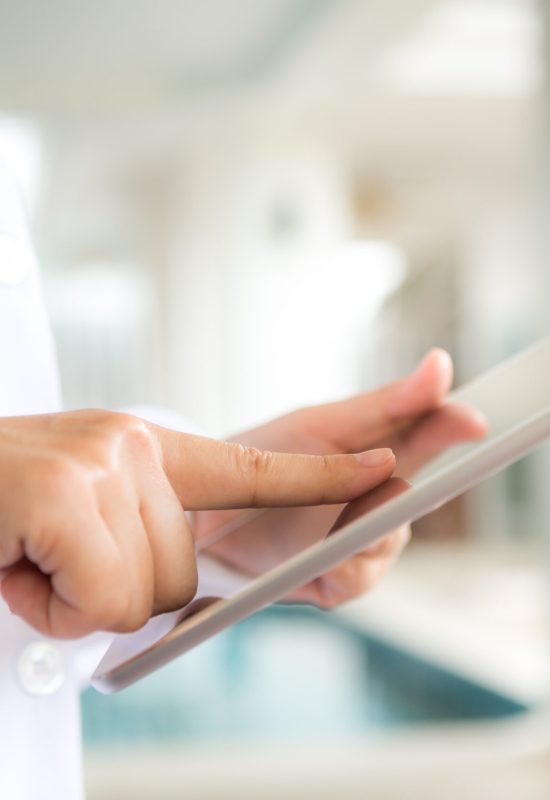 Doctor using tablet computer